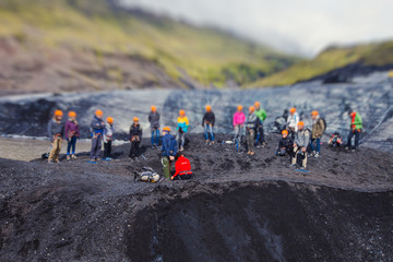 iceland glacier with a group of hikers hiking tourists climbing