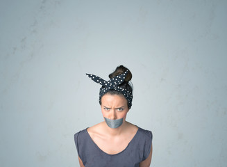 Wall Mural - Young woman with glued mouth