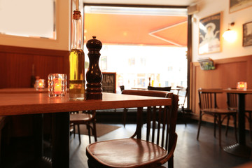 Wall Mural - Interior of the cafe, tables, chairs and a large window