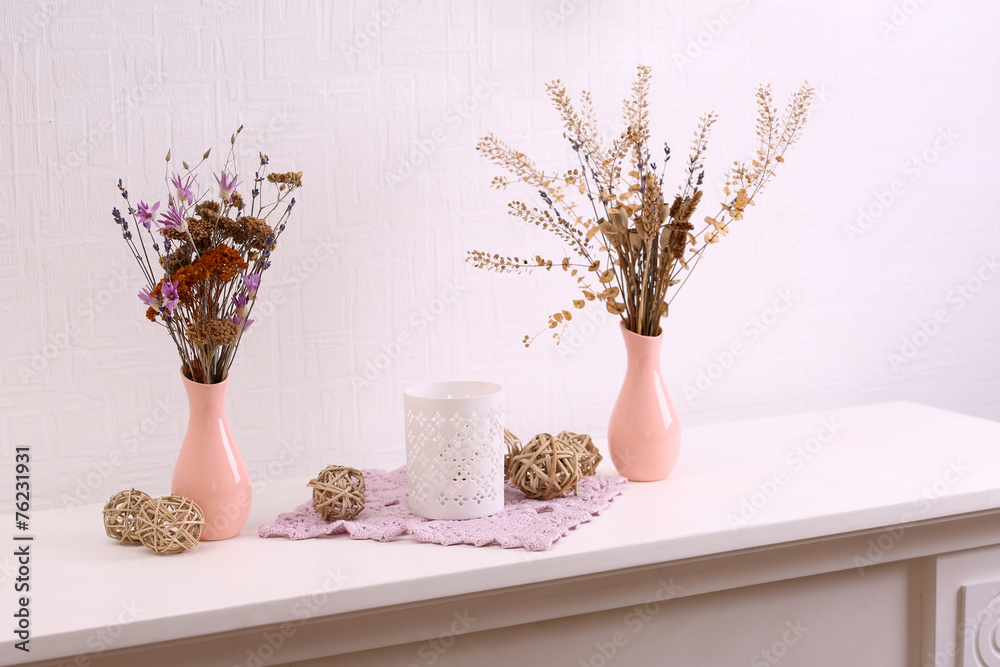 Still life of dried flowers on white wall background