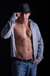 © V&P Photo Studio - muscular man with hat posing,on black background