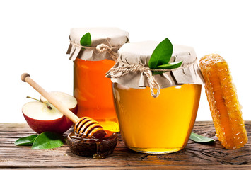 Wall Mural - Glass cans full of honey, apples. honeycombs. Clipping paths.