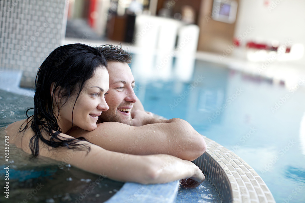 Couple relaxing in jacuzzi of spa center  - obrazy, fototapety, plakaty 