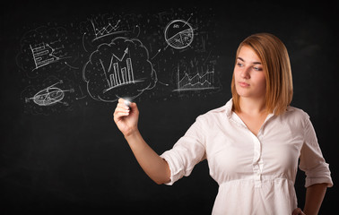 Young lady sketching financial chart icons and symbols