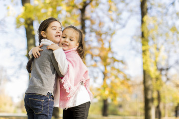 Canvas Print - Little girls in the autumn park