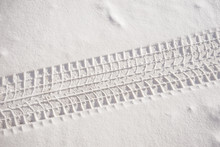 Fresh snow sedan tire track