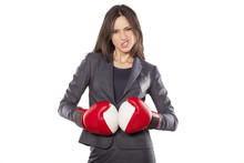 Portrait Of Angry Business Woman With Boxing Gloves