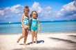 © travnikovstudio - Adorable little girls at beach during summer vacation