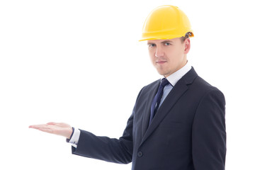 handsome business man or architect in yellow builder's helmet ho