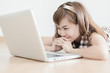 © Nonwarit - Asian woman using laptop at home