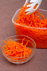 Wall Mural - Grated carrots in a container