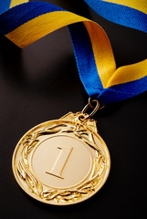 Wall Mural - gold medal on a dark background