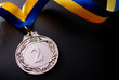 Silver medal on a dark background