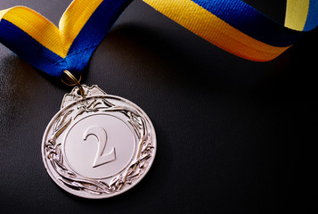 Wall Mural - silver medal on a dark background