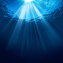 Abstract Underwater Backgrounds With Sun Beam And Water Ripple