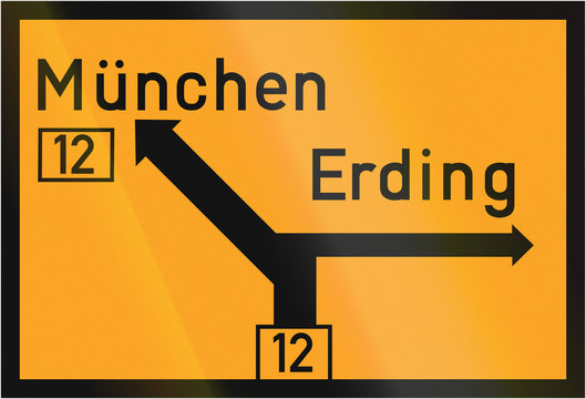Old design (1937) of a German direction sign on a federal road showing the way to Munich and Erding