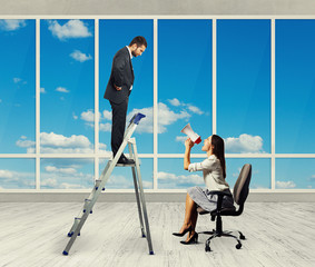 Canvas Print - woman with megaphone sitting on chair