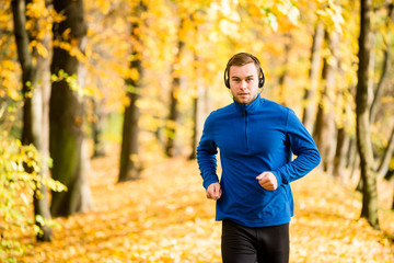 Wall Mural - Man jogging and listening music