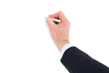 Hand of businessman writing with a white chalk