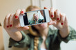 © nenetus - Young beautiful woman taking a selfie with smartphone in her new