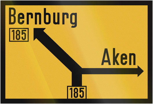 Old design (1956) of a German direction sign on a federal road showing the way to Bernburg and Aken