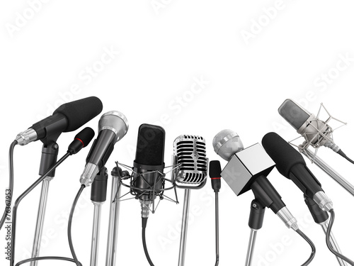 Fotografía Various microphones aligned at press conference isolated over a