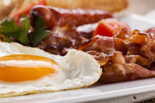 Full English Breakfast With Bacon, Sausage, Fried Egg, Baked Bea