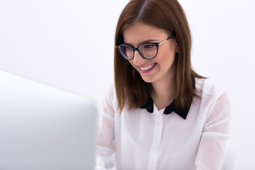 Canvas Print - Happy businesswoman working on the computer at office