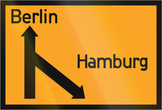 Old design (1936) of a German direction sign on a federal road showing the way to Berlin and Hamburg