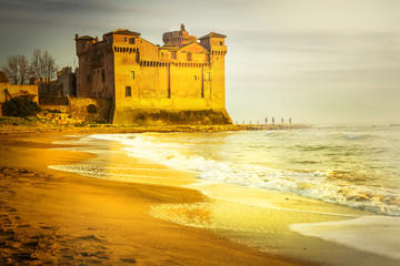 Sticker - golden castle. Castle Santa severa ocer sunset. Italy