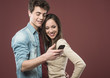 © stokkete - Young teen couple with smartphone