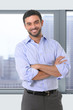 © Wordley Calvo Stock - young attractive business man standing in corporate portrait