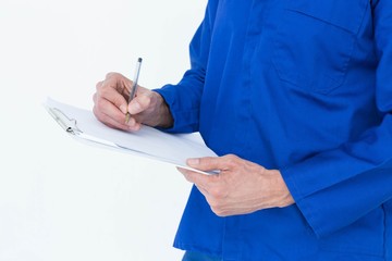 Poster - Mechanic writing notes on clipboard