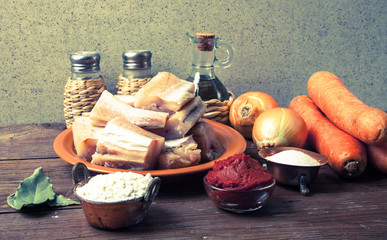 Wall Mural - Pieces of fresh fish on a plate, vegetables, flour, tomatoe past