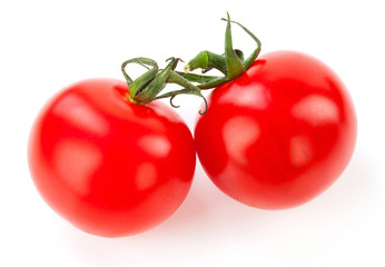 Juicy organic Cherry tomatoes with green leaf isolated over whit