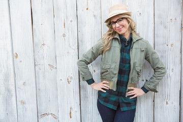 Poster - Smiling blonde in hat posing with hands on hips