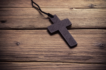 Sticker - wooden cross on wood background