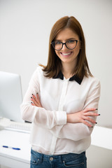 Poster - Portrait of a happy businesswoman in office