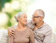 © Syda Productions - happy senior couple hugging on sofa at home