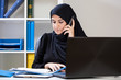 © Photographee.eu - Arab businesswoman watching documents