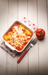 Wall Mural - baked polenta with tomato sauce and mozzarella