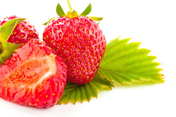 fresh cut strawberry with leaf macro isolated on white