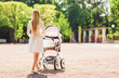 © Syda Productions - happy mother with stroller in park
