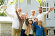 © Syda Productions - happy family waving hands in front of house