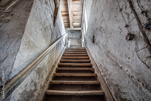 Naklejka dekoracyjna Wooden stairs in an abandoned house