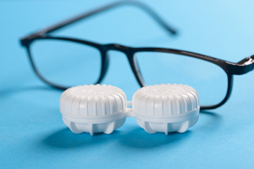 Eyeglasses And Lens Case On Blue Background