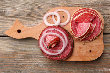 Wall Mural - Sliced salami with onion and spices