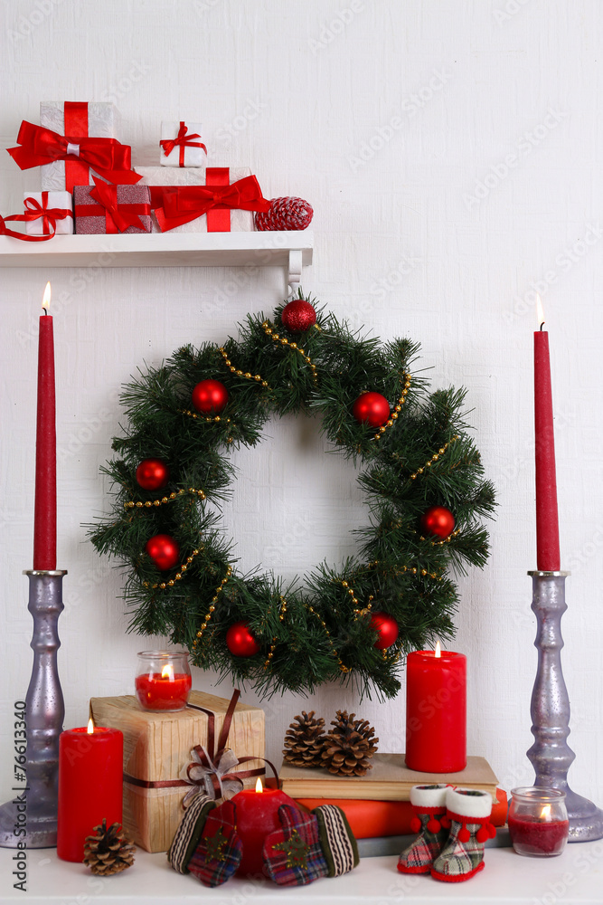 Christmas decoration with wreath, candles and present boxes