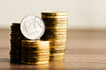 Wall Mural - The Russian rouble coin and gold money on the desk