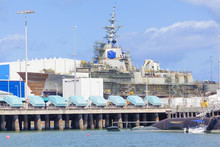 Destroyer Under Construction In A Naval Shipyard